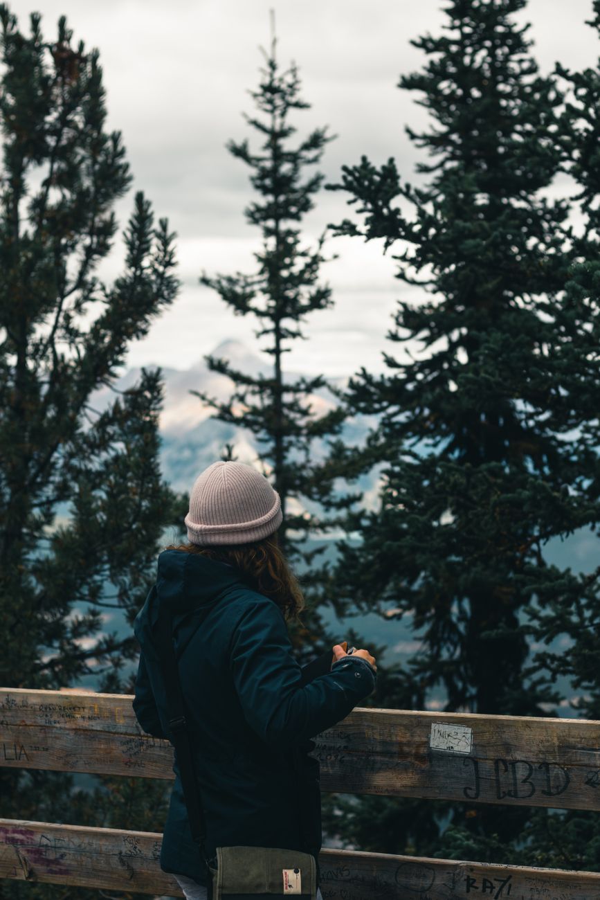 Travel author recording notes on mountain terrace