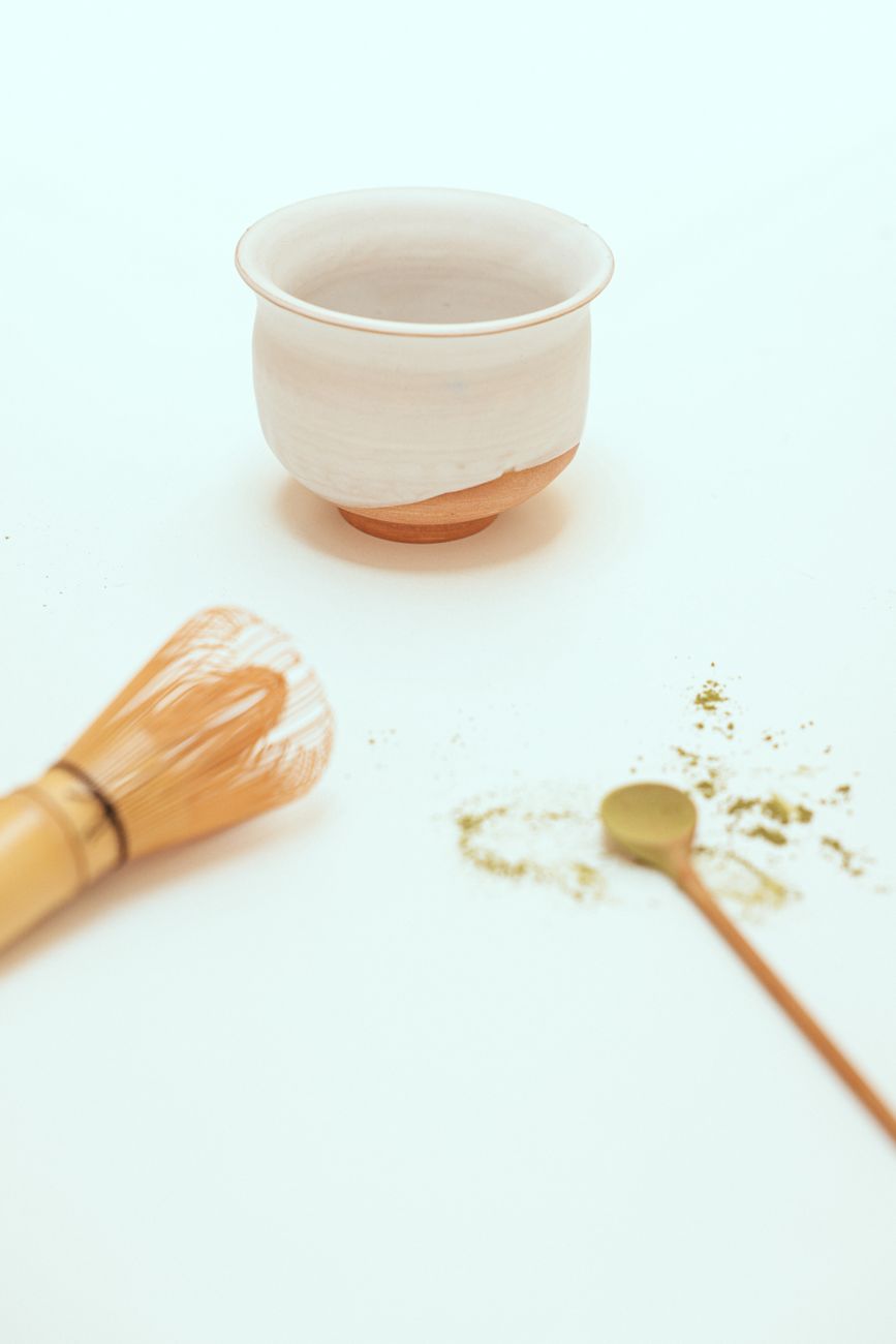 Ceramic tea vessel and whisk in Japanese tearoom